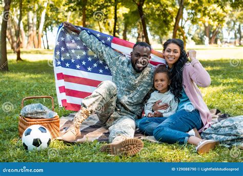 Happy African American Soldier In Military Uniform And Family Holding