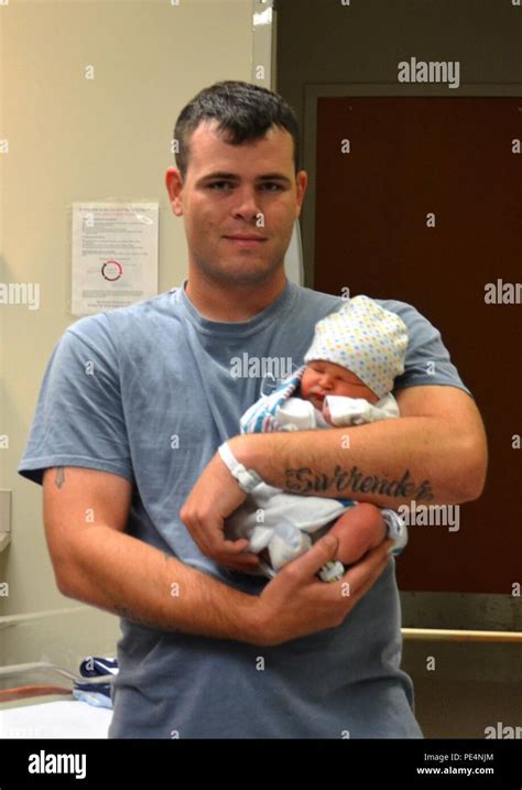 Micah Owens Holds His Newborn Son Greyson Owens At Winn Army Community