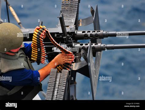 U S Navy Gunner S Mate Fires A 50 Caliber Machine Gun During Weapons