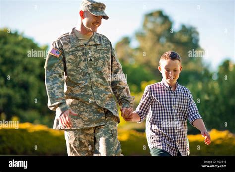 Us Army Soilder Holding Fmily