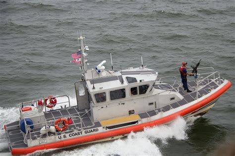 White Orange U S Coast Guard Boat On The Sea Free Stock Photo